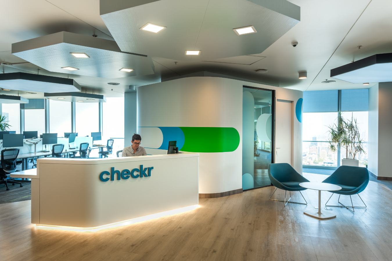 Checkr Offices - Modern reception area featuring the Checkr logo and custom hexagonal lighting - Contract Workplaces.jpg
